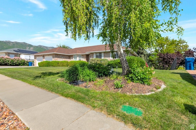 5760 S 1050 E, South Ogden, UT 84405 - single story home with a garage, a front lawn, a mountain view, and concrete driveway