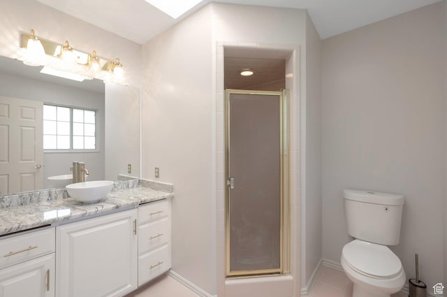 5760 S 1050 E, South Ogden, UT 84405 - full bath with vanity, a shower stall, baseboards, toilet, and tile patterned floors