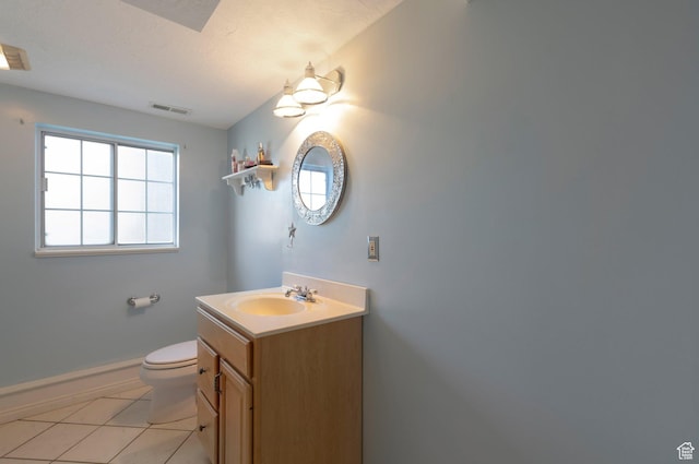 5760 S 1050 E, South Ogden, UT 84405 - bathroom with toilet, vanity, healthy amount of natural light, and baseboards