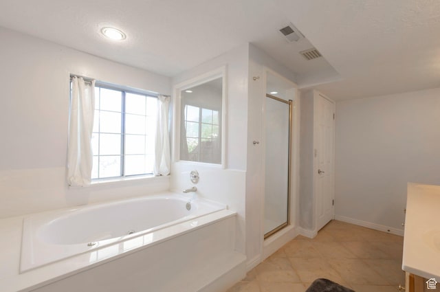 5760 S 1050 E, South Ogden, UT 84405 - bathroom with vanity, a garden tub, a shower stall, tile patterned flooring, and recessed lighting