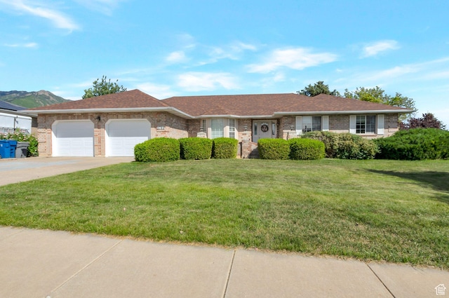 5760 S 1050 E, South Ogden, UT 84405 - ranch-style house featuring a garage, concrete driveway, a front lawn, and brick siding