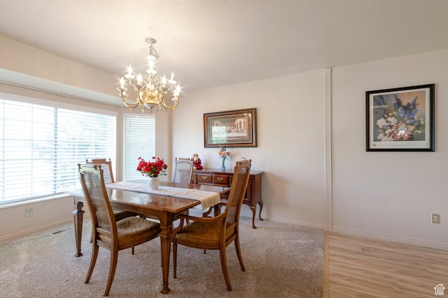 5760 S 1050 E, South Ogden, UT 84405 - dining space featuring a chandelier, plenty of natural light, and baseboards