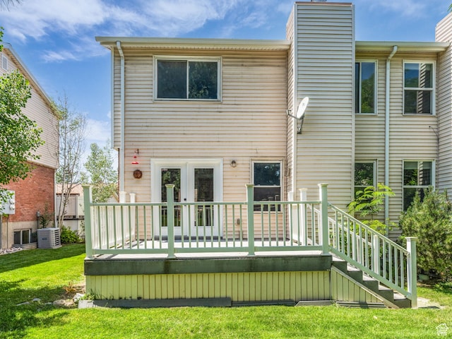 8335 S 1050 E, Sandy, UT 84094 - back of property featuring a chimney, central AC unit, a wooden deck, french doors, and a yard
