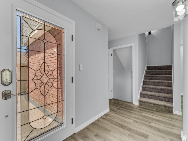 8335 S 1050 E, Sandy, UT 84094 - foyer with wood finished floors, stairway, and baseboards