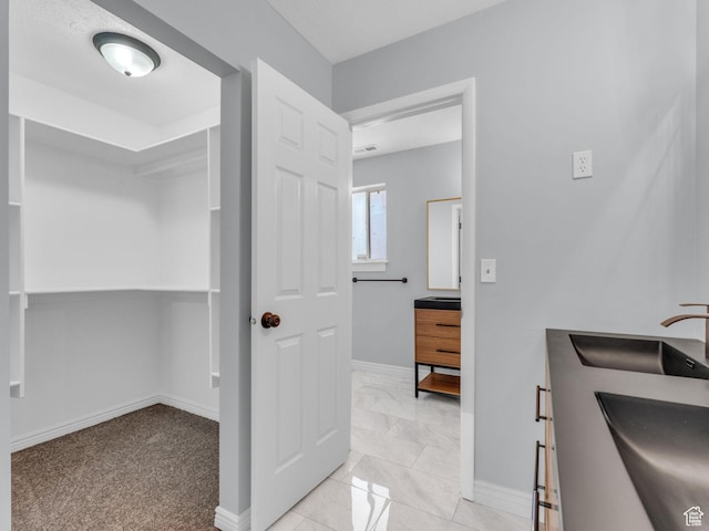 8335 S 1050 E, Sandy, UT 84094 - bathroom with double vanity and baseboards