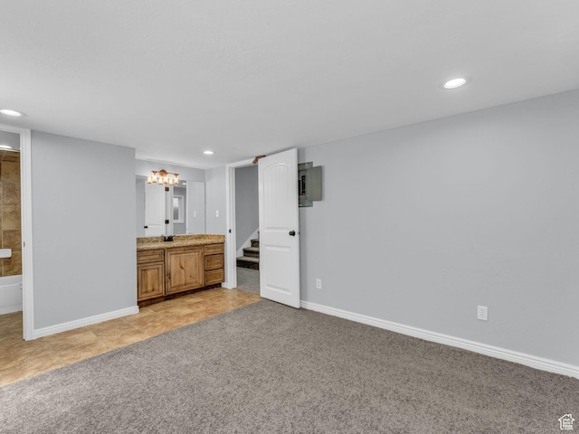 8335 S 1050 E, Sandy, UT 84094 - unfurnished bedroom with baseboards, ensuite bathroom, recessed lighting, light tile patterned flooring, and electric panel