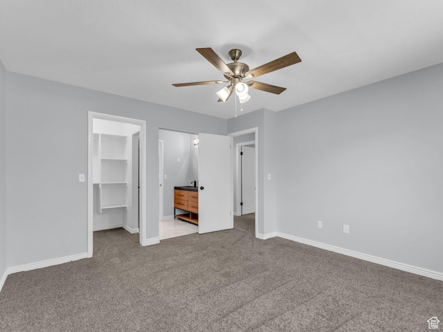 8335 S 1050 E, Sandy, UT 84094 - unfurnished bedroom with a walk in closet, carpet, baseboards, and a closet