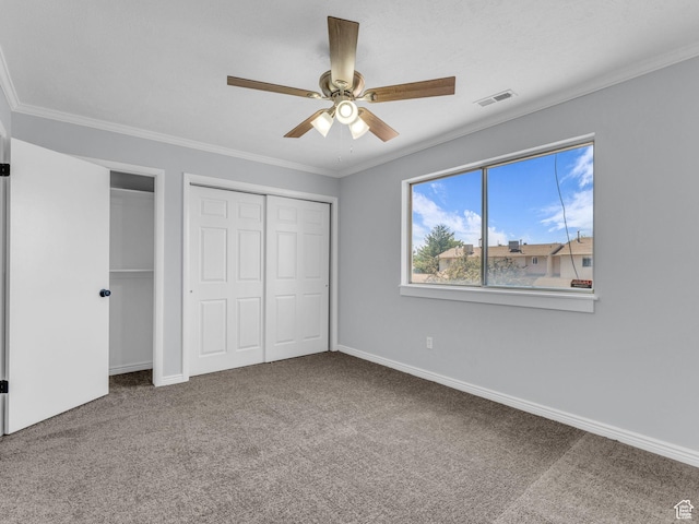 8335 S 1050 E, Sandy, UT 84094 - unfurnished bedroom with carpet, two closets, baseboards, ornamental molding, and a ceiling fan