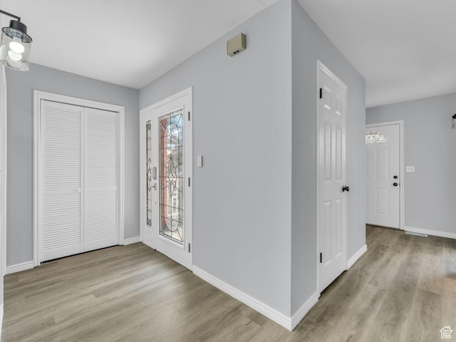8335 S 1050 E, Sandy, UT 84094 - foyer entrance with wood finished floors and baseboards