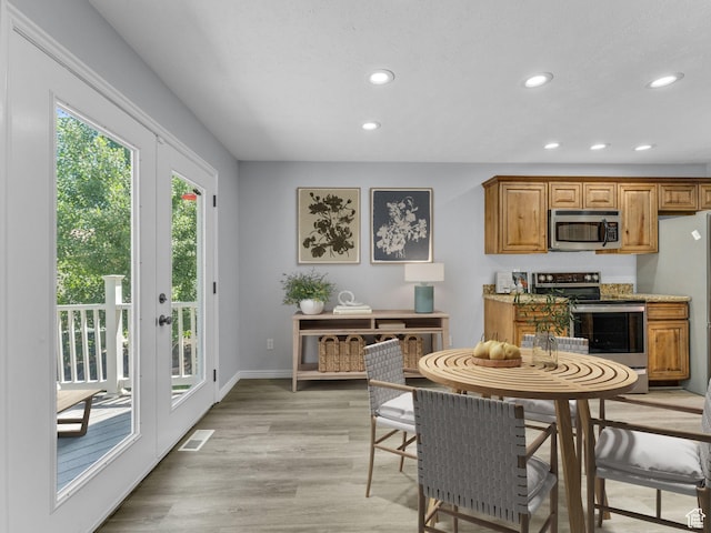 8335 S 1050 E, Sandy, UT 84094 - kitchen with appliances with stainless steel finishes, recessed lighting, light wood-style floors, baseboards, and brown cabinets