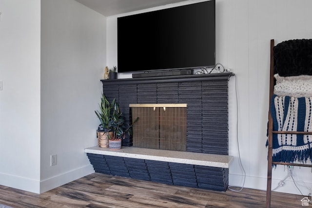 1185 E Hillcrest Dr, Springville, UT 84663 - detailed view of baseboards, wood finished floors, and a fireplace