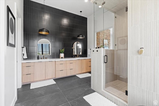 11527 S River Front Pkwy W, South Jordan, UT 84095 - bathroom featuring double vanity, a stall shower, tile walls, tile patterned flooring, and plenty of natural light