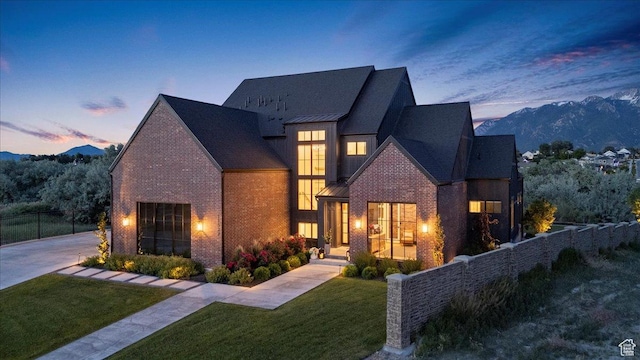 11527 S River Front Pkwy W, South Jordan, UT 84095 - view of front of home with brick siding and a mountain view