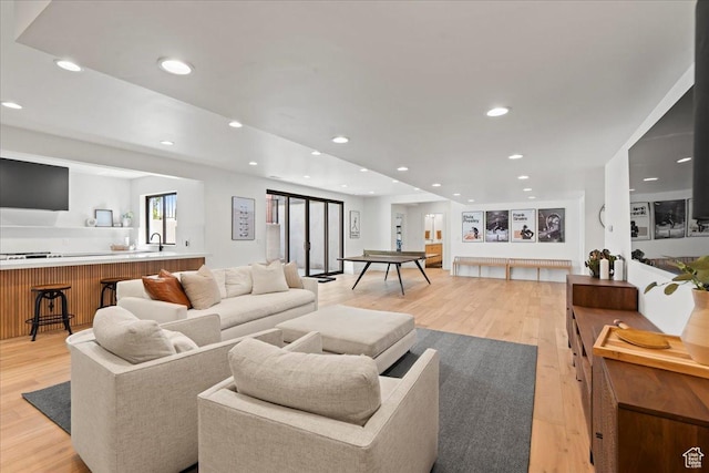 11527 S River Front Pkwy W, South Jordan, UT 84095 - living room featuring light wood-style flooring and recessed lighting