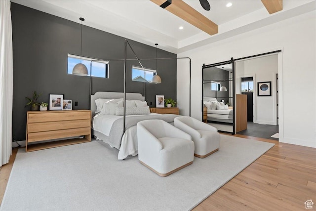 11527 S River Front Pkwy W, South Jordan, UT 84095 - bedroom with light wood finished floors, beam ceiling, recessed lighting, a barn door, and baseboards