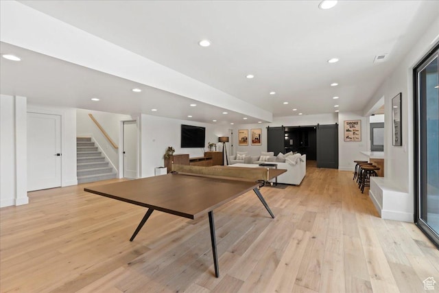 11527 S River Front Pkwy W, South Jordan, UT 84095 - recreation room featuring light wood-style floors, recessed lighting, and a barn door