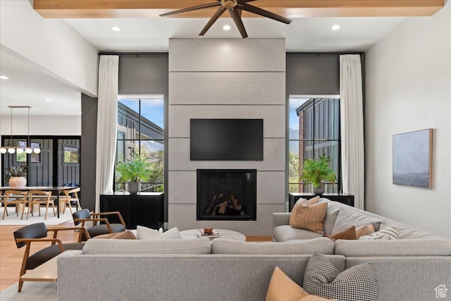 11527 S River Front Pkwy W, South Jordan, UT 84095 - living room featuring a ceiling fan, wood finished floors, a fireplace, and recessed lighting