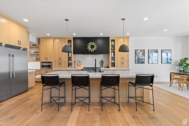 11527 S River Front Pkwy W, South Jordan, UT 84095 - kitchen with appliances with stainless steel finishes, light brown cabinetry, light countertops, recessed lighting, and light wood finished floors