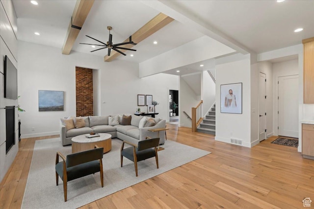 11527 S River Front Pkwy W, South Jordan, UT 84095 - living room with light wood-type flooring, stairs, ceiling fan, baseboards, and recessed lighting