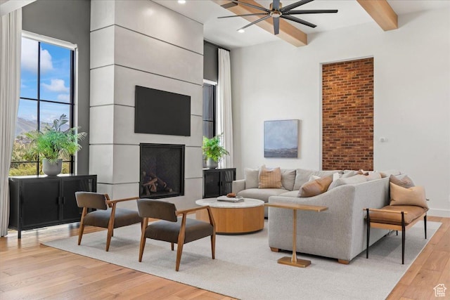 11527 S River Front Pkwy W, South Jordan, UT 84095 - living room featuring ceiling fan, light wood-style flooring, beamed ceiling, a fireplace, and recessed lighting