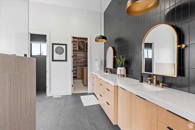 11527 S River Front Pkwy W, South Jordan, UT 84095 - full bathroom with double vanity, tile patterned floors, plenty of natural light, and baseboards