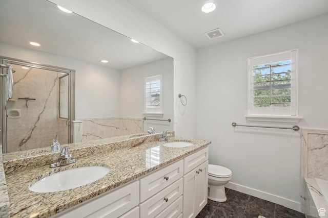 157 N Keogh Ln W, Ogden, UT 84404 - full bathroom with healthy amount of natural light, double vanity, a marble finish shower, toilet, and recessed lighting