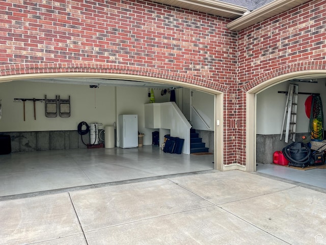 66 N 325th St E, Farmington, UT 84025 - garage featuring freestanding refrigerator and driveway
