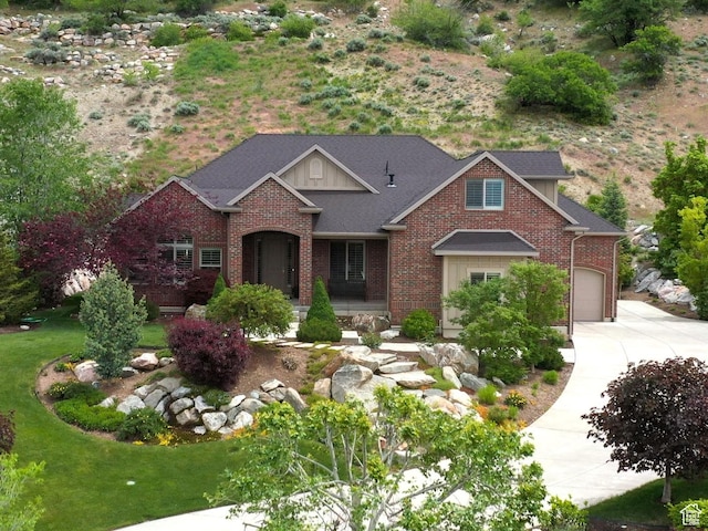 66 N 325th St E, Farmington, UT 84025 - view of front of home with driveway, brick siding, and an attached garage