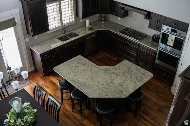66 N 325th St E, Farmington, UT 84025 - kitchen featuring stainless steel appliances, a sink, tasteful backsplash, and dark wood-style flooring