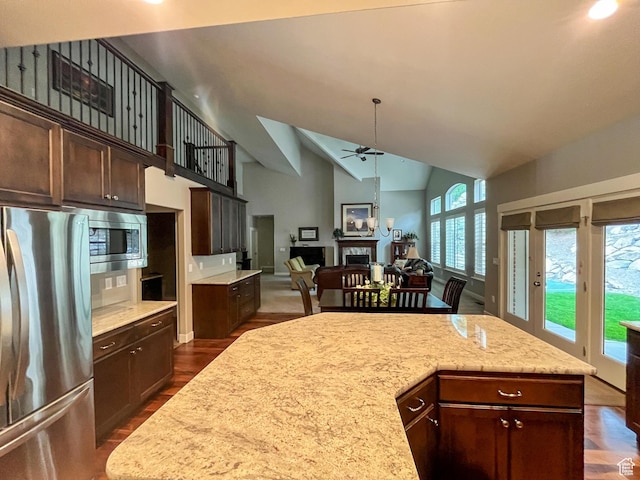 66 N 325th St E, Farmington, UT 84025 - kitchen featuring appliances with stainless steel finishes, a ceiling fan, dark brown cabinetry, dark wood-style flooring, and high vaulted ceiling