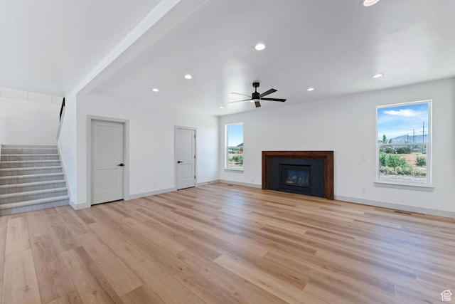 1136 W 1450 S, Lehi, UT 84043 - unfurnished living room with light wood-style flooring, stairs, ceiling fan, recessed lighting, and a fireplace