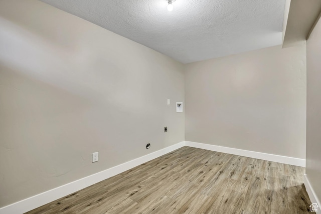 8689 W Edith Dr, Magna, UT 84044 - unfurnished room with baseboards, wood finished floors, and a textured ceiling