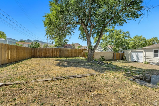 8689 W Edith Dr, Magna, UT 84044 - fenced backyard featuring a garage