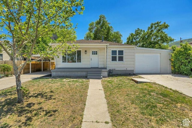 8689 W Edith Dr, Magna, UT 84044 - view of front of home featuring driveway and an attached garage