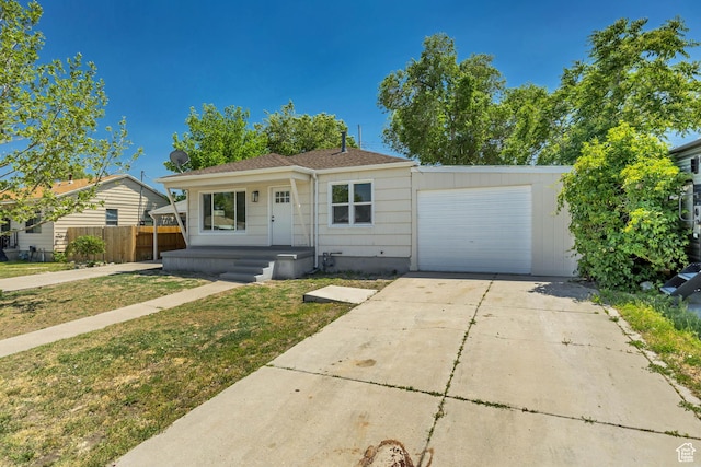 8689 W Edith Dr, Magna, UT 84044 - view of front facade featuring a garage and driveway