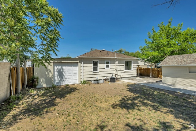 8689 W Edith Dr, Magna, UT 84044 - back of house featuring central AC