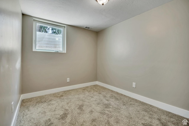 8689 W Edith Dr, Magna, UT 84044 - carpeted empty room with baseboards and a textured ceiling