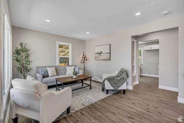 8689 W Edith Dr, Magna, UT 84044 - living room with baseboards, wood finished floors, and recessed lighting