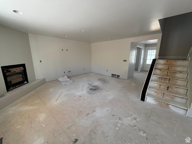 698 N Sunset Dr, Morgan, UT 84050 - unfurnished living room featuring stairway and a fireplace