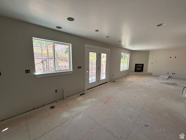 698 N Sunset Dr, Morgan, UT 84050 - unfurnished living room featuring a fireplace with raised hearth and recessed lighting