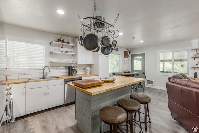 2237 Samak Park Ct Unit 4, Kamas, UT 84036 - kitchen featuring wood counters, a sink, stainless steel appliances, open floor plan, and a breakfast bar