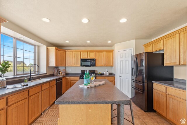 2271 W Pointe Meadow Dr N, Lehi, UT 84043 - kitchen featuring black microwave, stove, fridge with ice dispenser, dark countertops, and a breakfast bar area