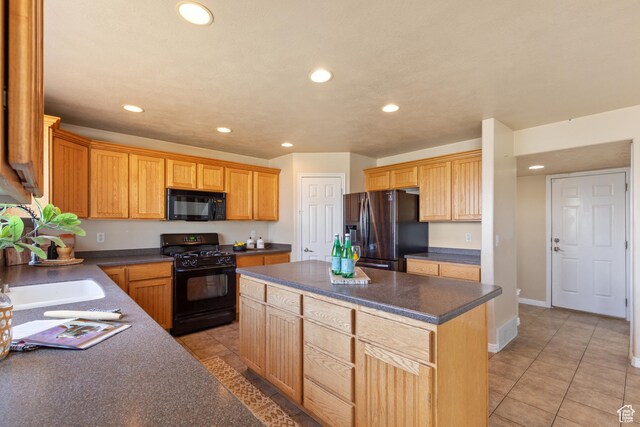 2271 W Pointe Meadow Dr N, Lehi, UT 84043 - kitchen featuring black appliances, recessed lighting, dark countertops, a kitchen island, and light tile patterned floors