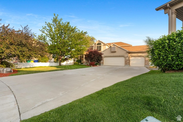 2271 W Pointe Meadow Dr N, Lehi, UT 84043 - view of front of home featuring a front lawn, concrete driveway, a garage, and stucco siding