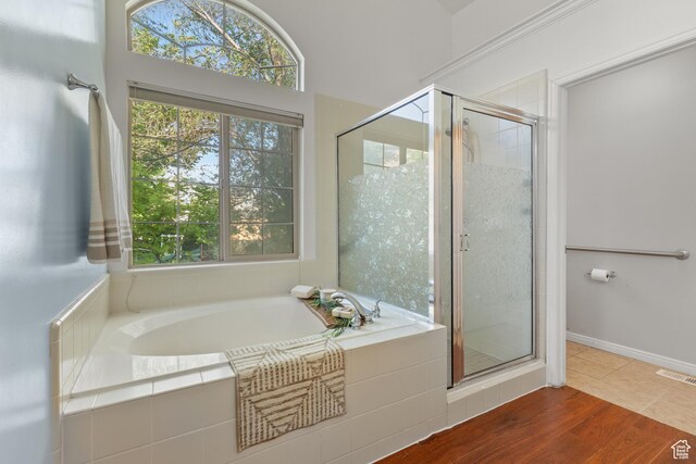 2271 W Pointe Meadow Dr N, Lehi, UT 84043 - bathroom with healthy amount of natural light, a garden tub, and a stall shower