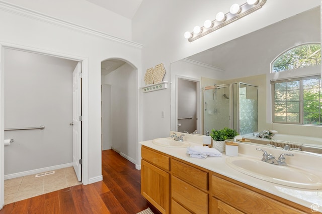 2271 W Pointe Meadow Dr N, Lehi, UT 84043 - full bathroom featuring a shower stall, a bath, double vanity, and wood finished floors