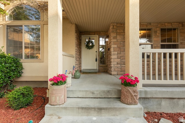 2271 W Pointe Meadow Dr N, Lehi, UT 84043 - entrance to property featuring a porch, stucco siding, and stone siding