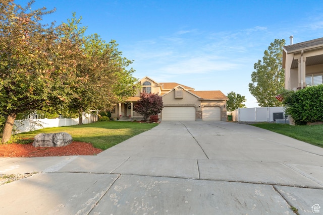 2271 W Pointe Meadow Dr N, Lehi, UT 84043 - view of property hidden behind natural elements featuring a garage, concrete driveway, stucco siding, and a gate