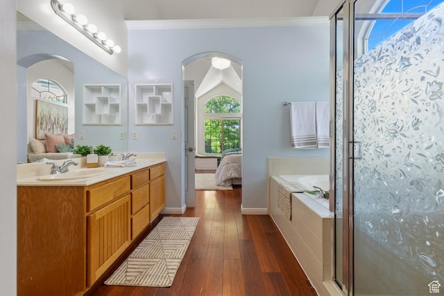 2271 W Pointe Meadow Dr N, Lehi, UT 84043 - ensuite bathroom featuring a bath, double vanity, hardwood / wood-style flooring, a shower stall, and crown molding