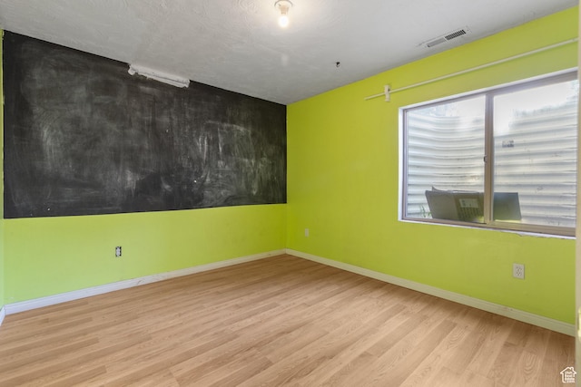 2271 W Pointe Meadow Dr N, Lehi, UT 84043 - spare room featuring wood finished floors and baseboards
